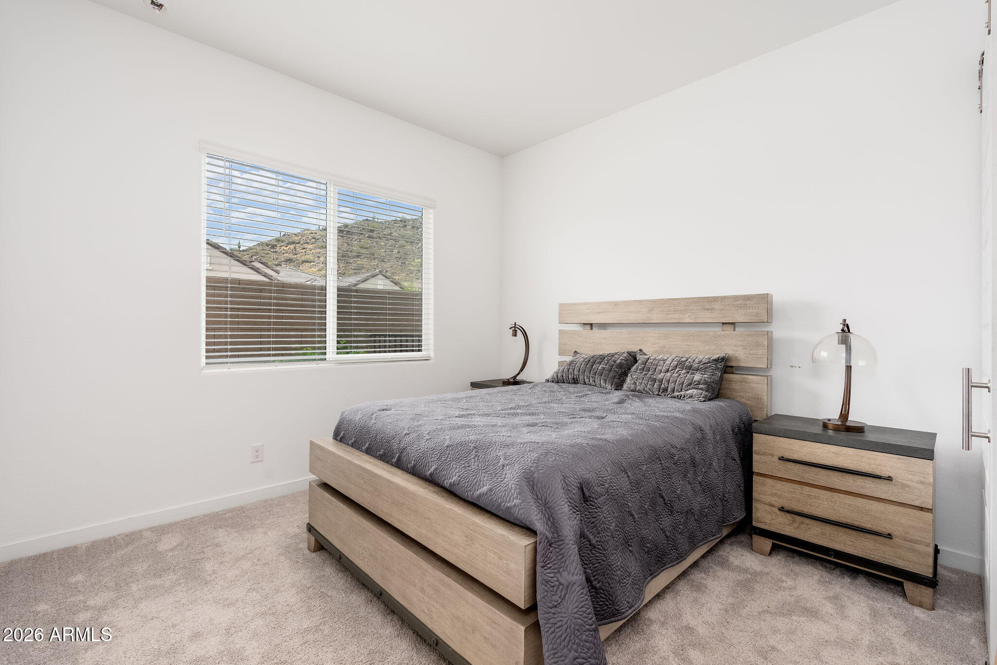 3272 West Peak View Road Phoenix, AZ 85083 - Photo 28 of 47 a bedroom with a bed and a window