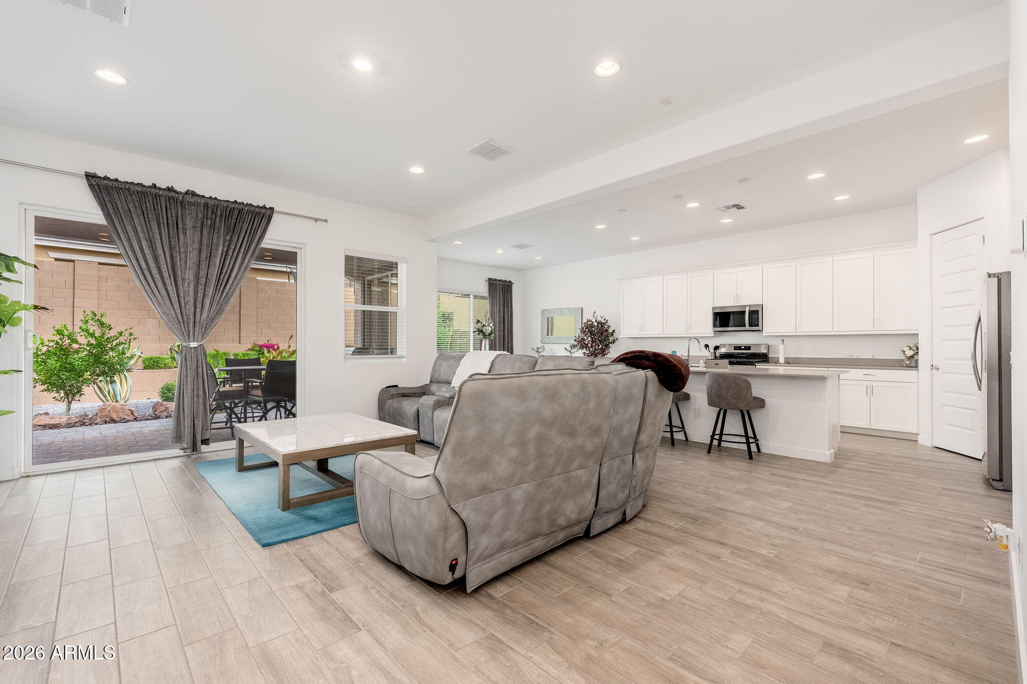 3272 West Peak View Road Phoenix, AZ 85083 - Photo 3 of 47 a living room with furniture and a wooden floor