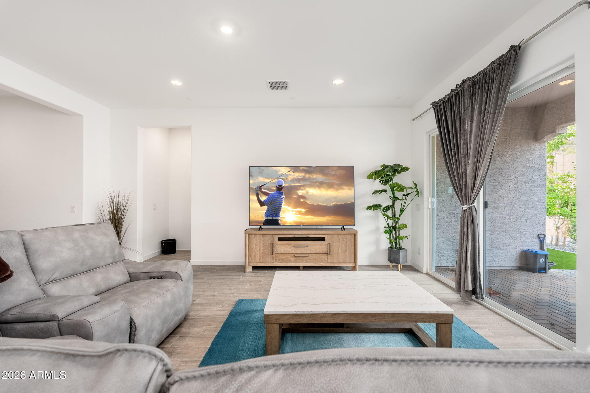 3272 West Peak View Road Phoenix, AZ 85083 - Photo 5 of 47 a living room with furniture and a flat screen tv