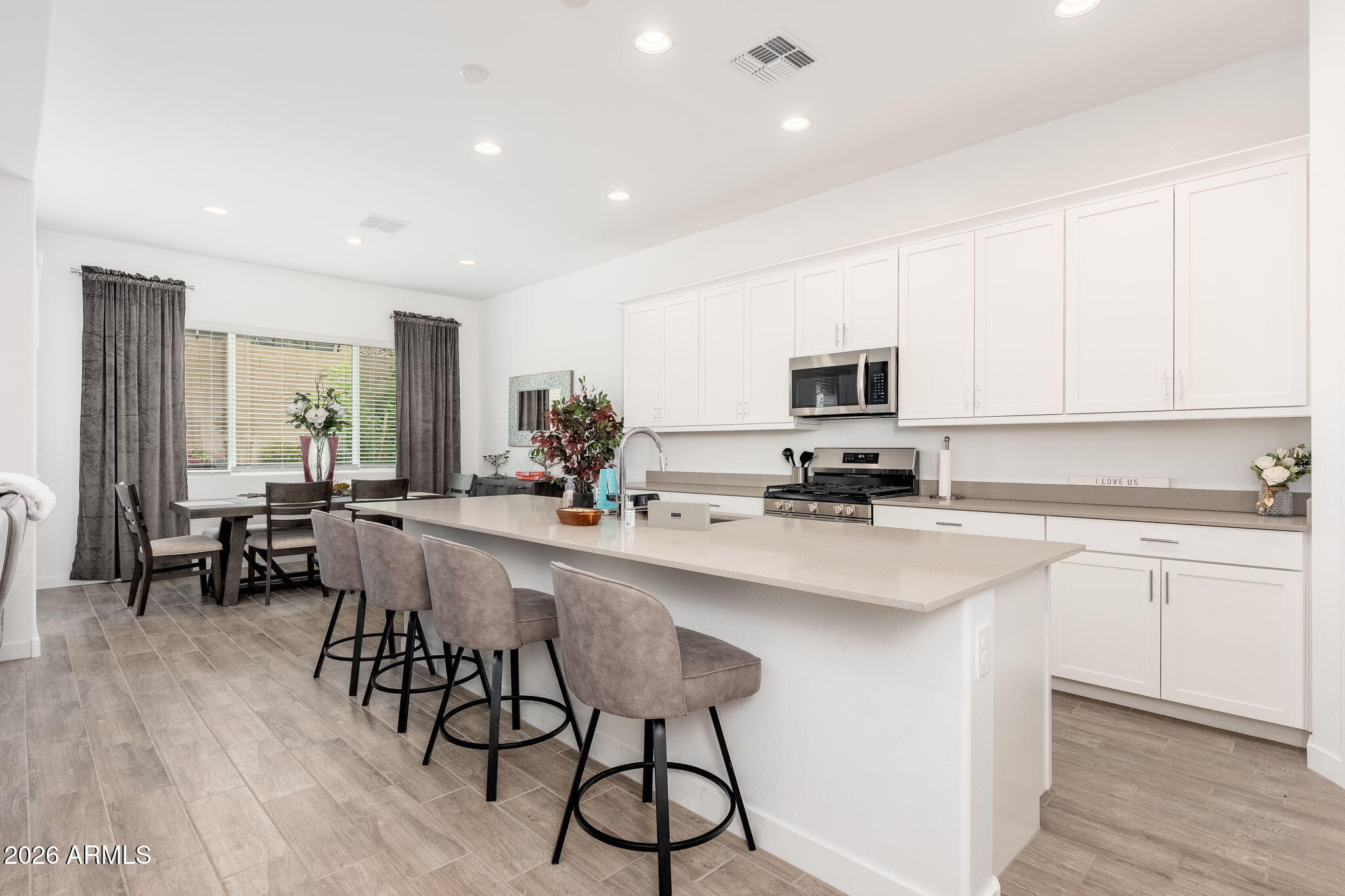 3272 West Peak View Road Phoenix, AZ 85083 - Photo 6 of 47 a kitchen with a sink cabinets and wooden floor