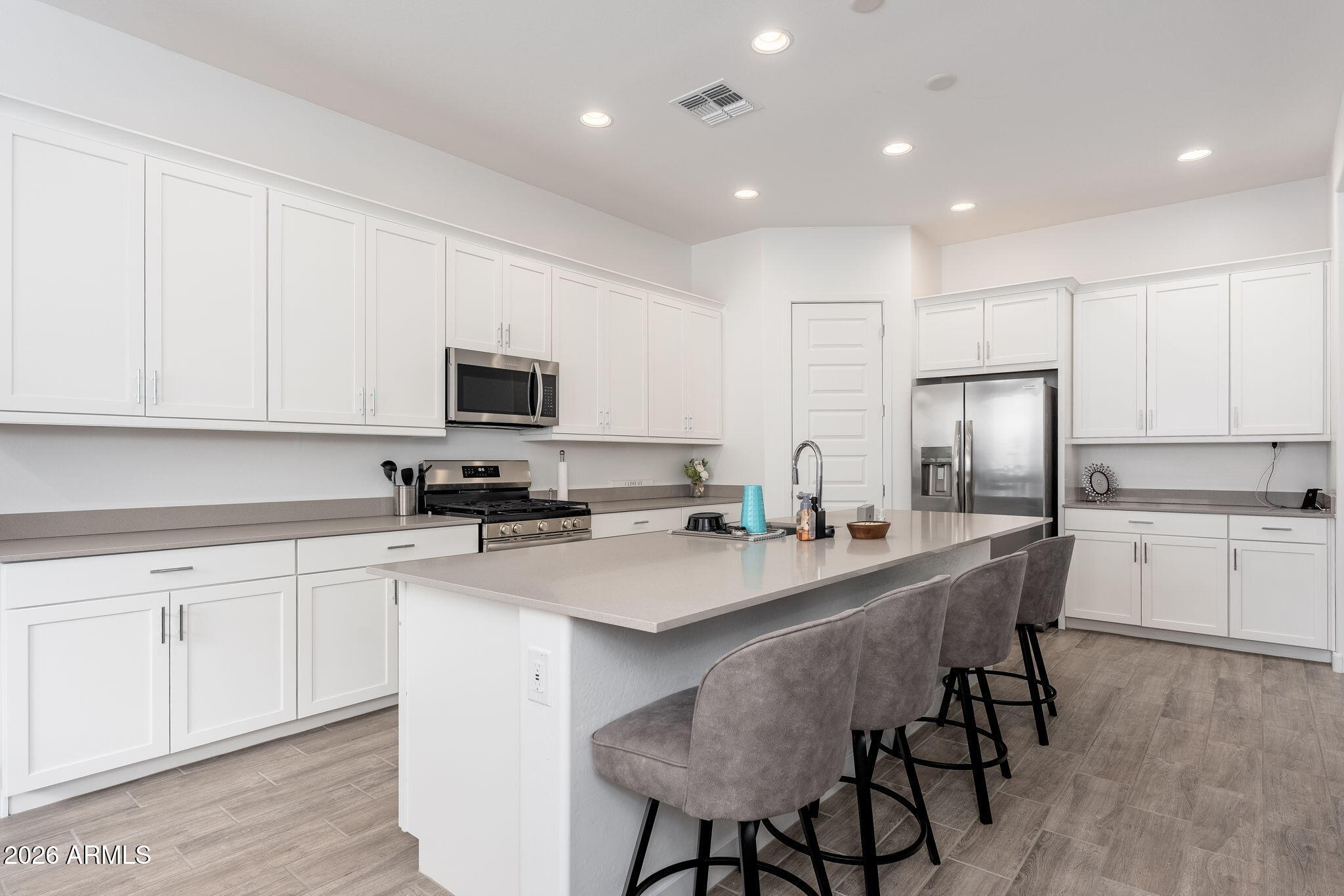 3272 West Peak View Road Phoenix, AZ 85083 - Photo 7 of 47 a kitchen with appliances a sink and cabinets