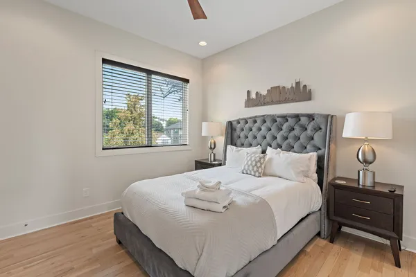 a bedroom with a bed and a window