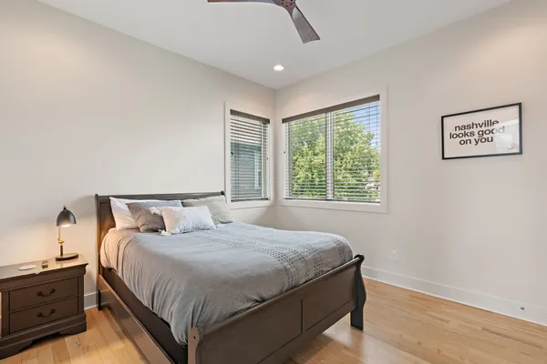 a bedroom with a bed and a window