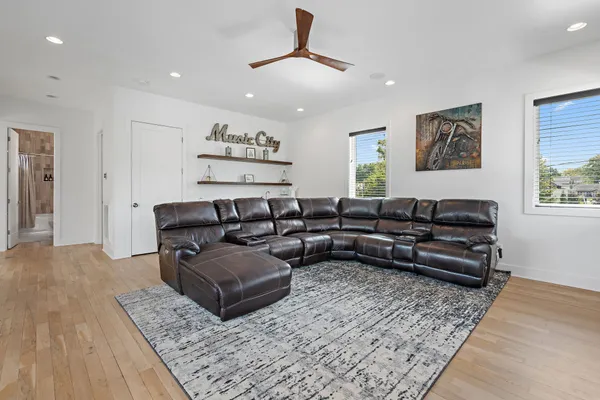 a living room with furniture and a rug