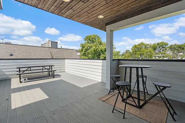 a view of a balcony with chairs