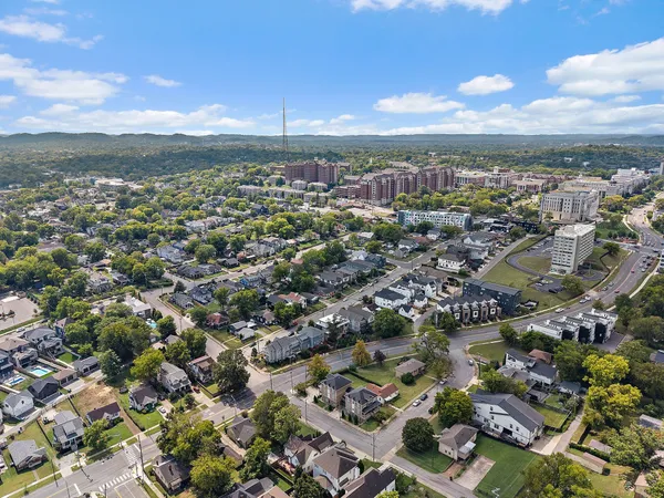 an aerial view of city and lake