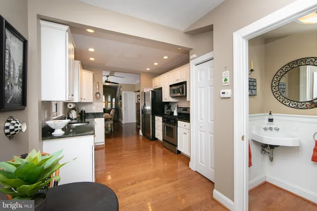 a view of living room kitchen and entryway