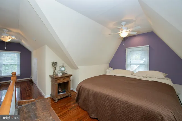 a bedroom with a bed and a fireplace