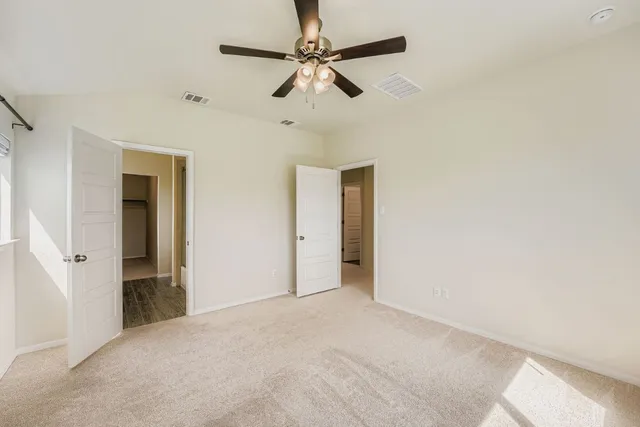 a bathroom with a glass shower door