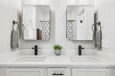 a bathroom with sink and a mirror