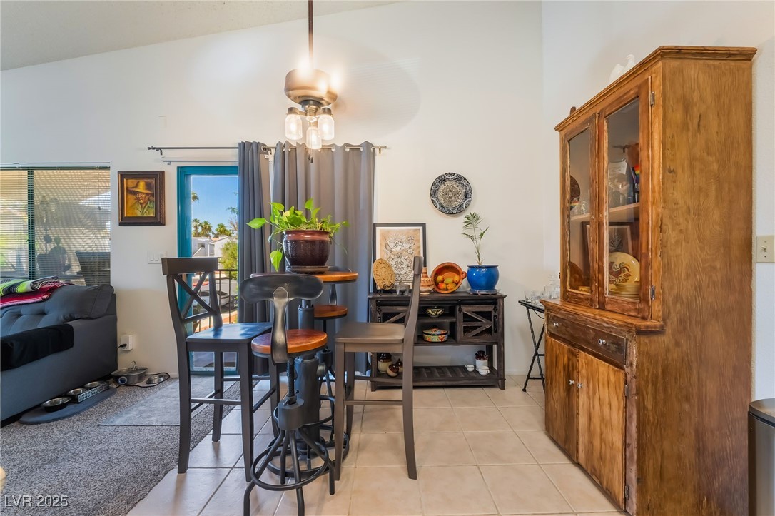 1575 West Warm Springs Road, Unit 2822 Henderson, NV 89014 - Photo 16 of 37 Dining area featuring light tile patterned floors and a ceiling fan