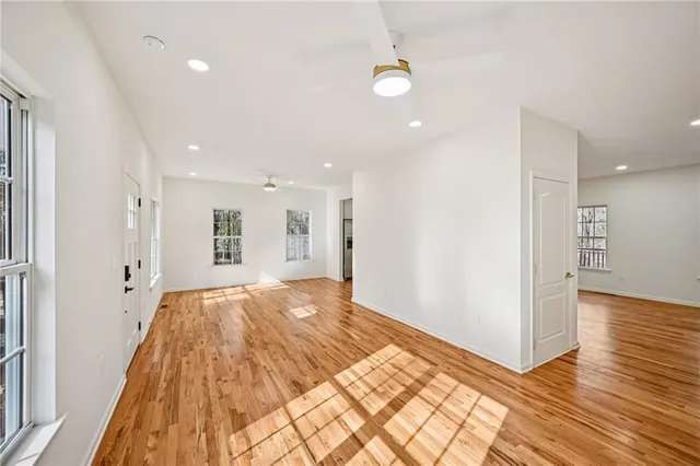 a bathroom with a granite countertop toilet a sink and a mirror