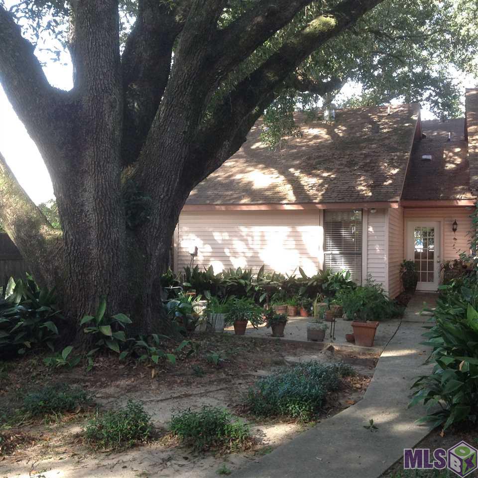 3953 Partridge Lane Baton Rouge, LA 70809 - Photo 16 of 19 back view with oak tree