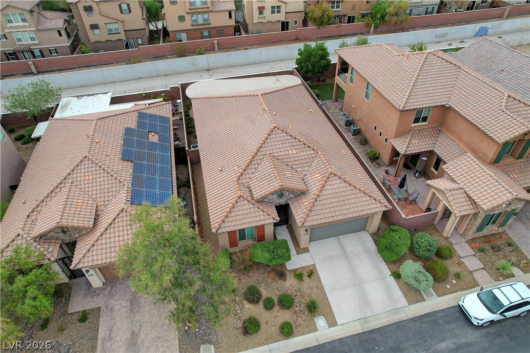 7049 Motley Road Las Vegas, NV 89178 - Photo 60 of 61 Tiled roofs and neat desert landscaping define this inviting suburban neighborhood streetscape.