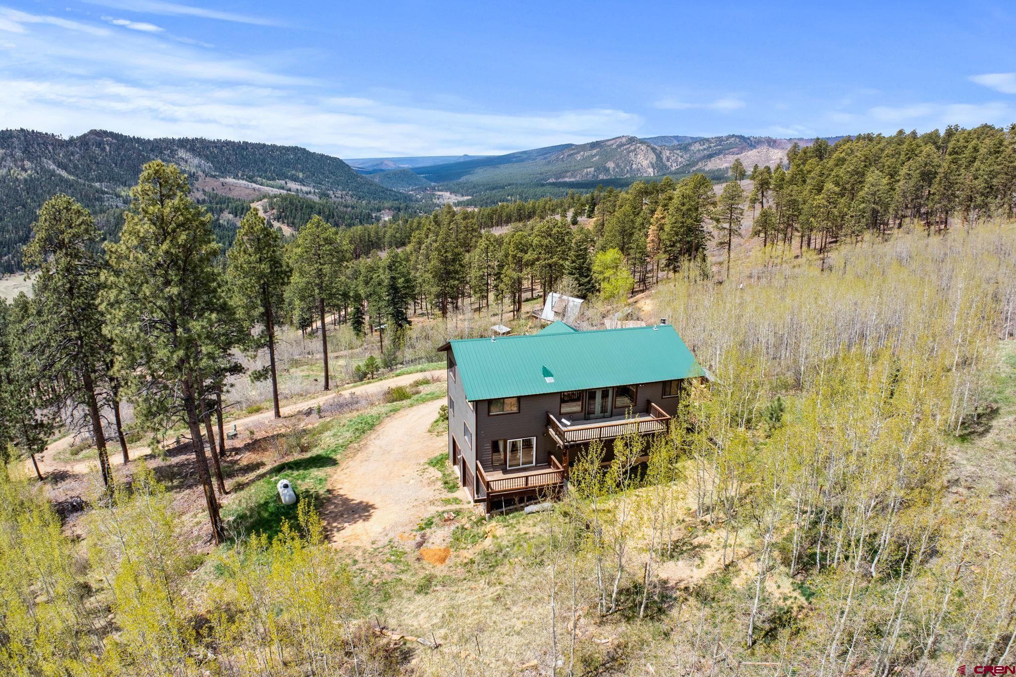 151 Sunny Lane Durango, CO 81301 - Photo 1 of 35 a view of a lake with a mountain in the background