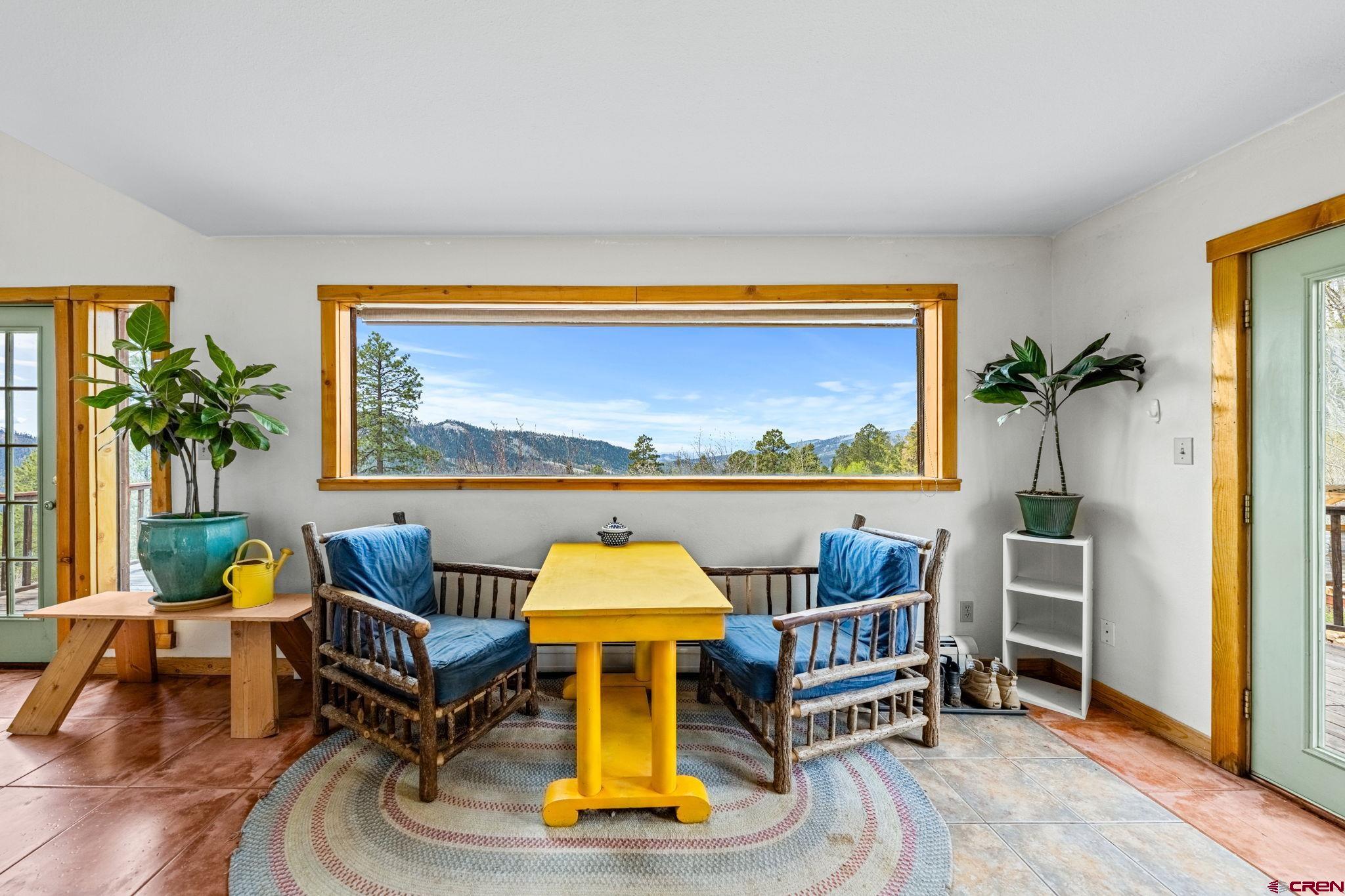 151 Sunny Lane Durango, CO 81301 - Photo 12 of 35 a living room with furniture and a flat screen tv
