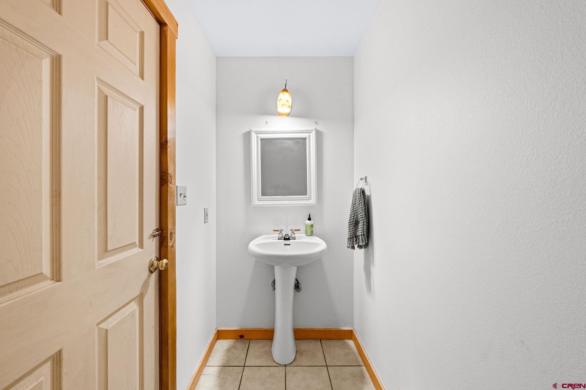 151 Sunny Lane Durango, CO 81301 - Photo 17 of 35 a bathroom with a sink and a mirror