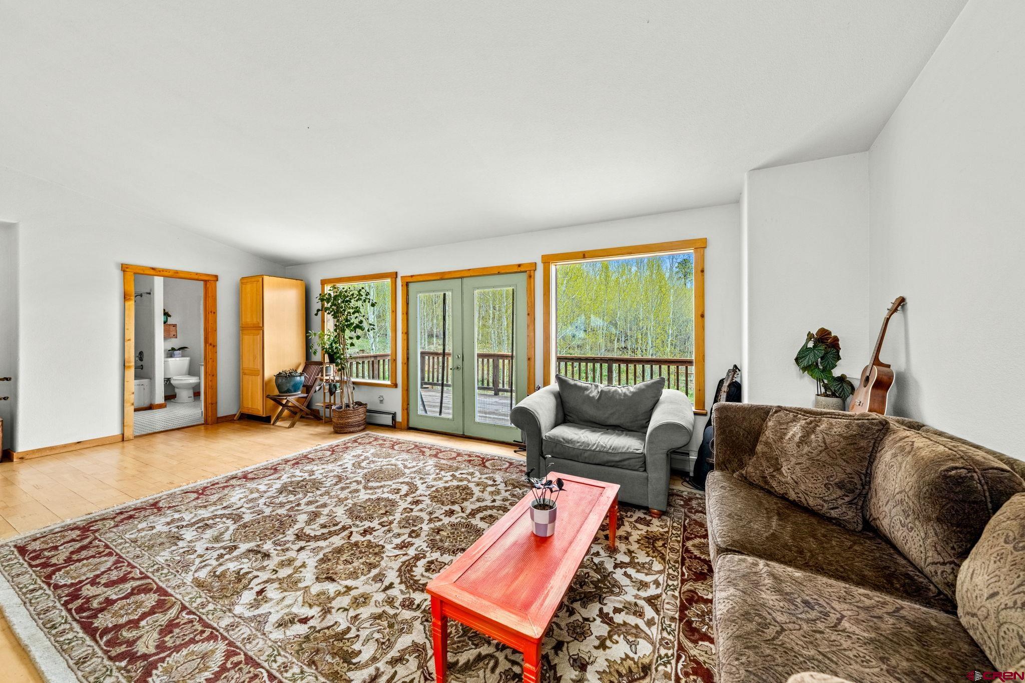 151 Sunny Lane Durango, CO 81301 - Photo 23 of 35 a living room with furniture and a large window