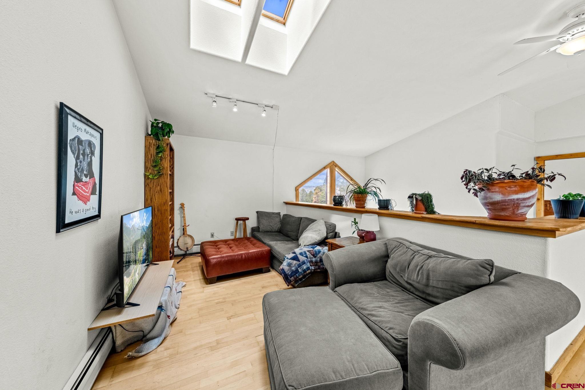 151 Sunny Lane Durango, CO 81301 - Photo 24 of 35 a living room with furniture a couch and a window