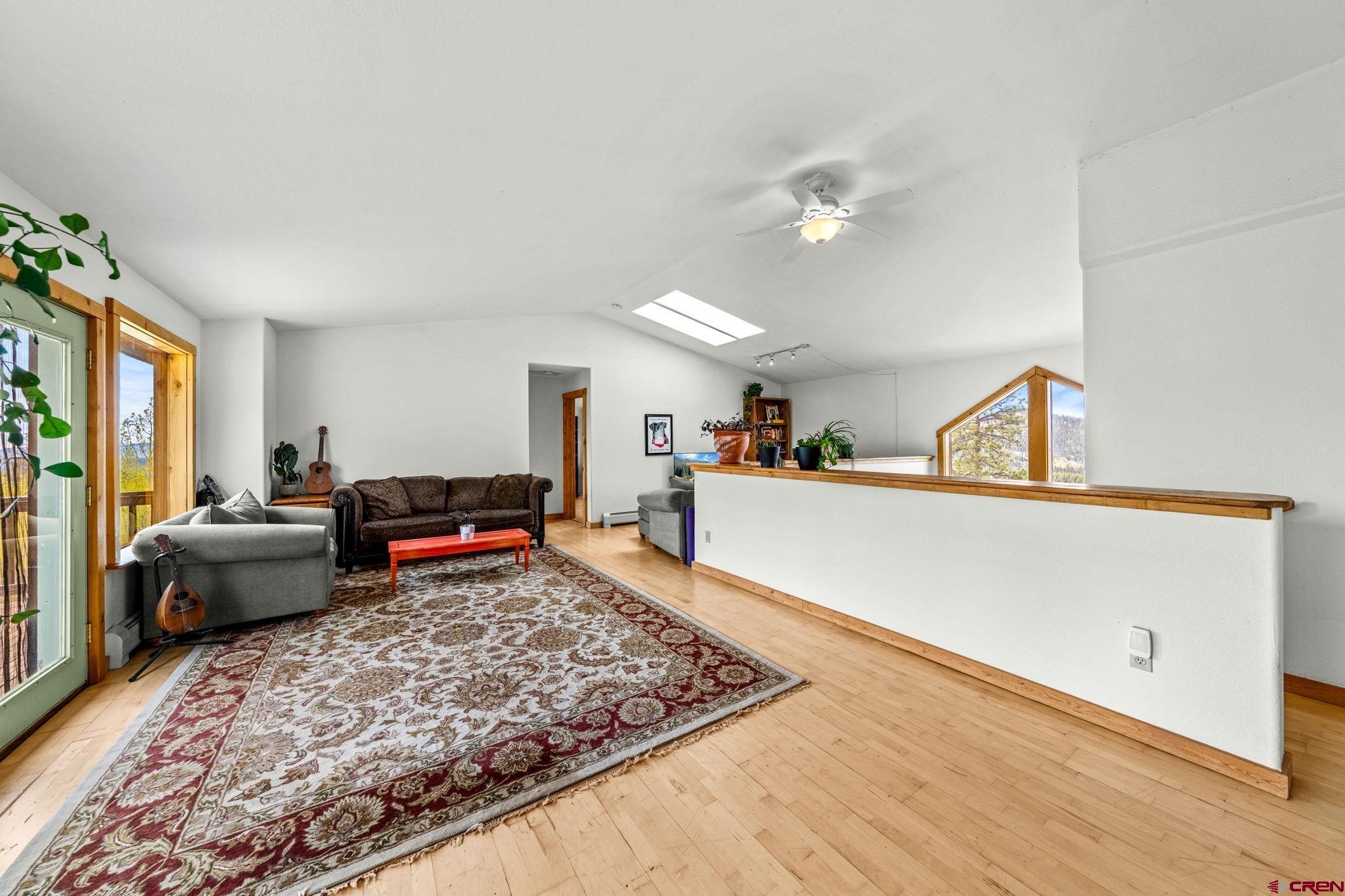 151 Sunny Lane Durango, CO 81301 - Photo 25 of 35 a living room with furniture and a rug