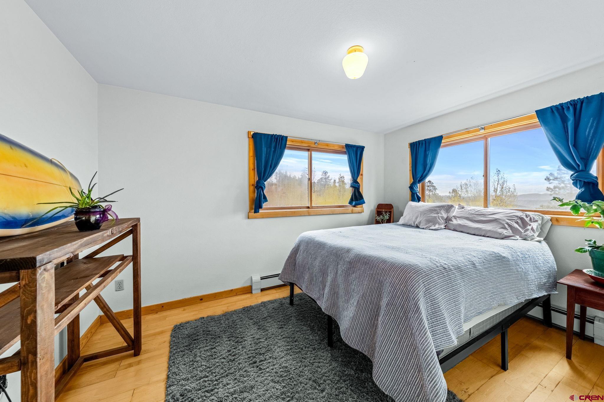 151 Sunny Lane Durango, CO 81301 - Photo 28 of 35 a bedroom with a bed and window