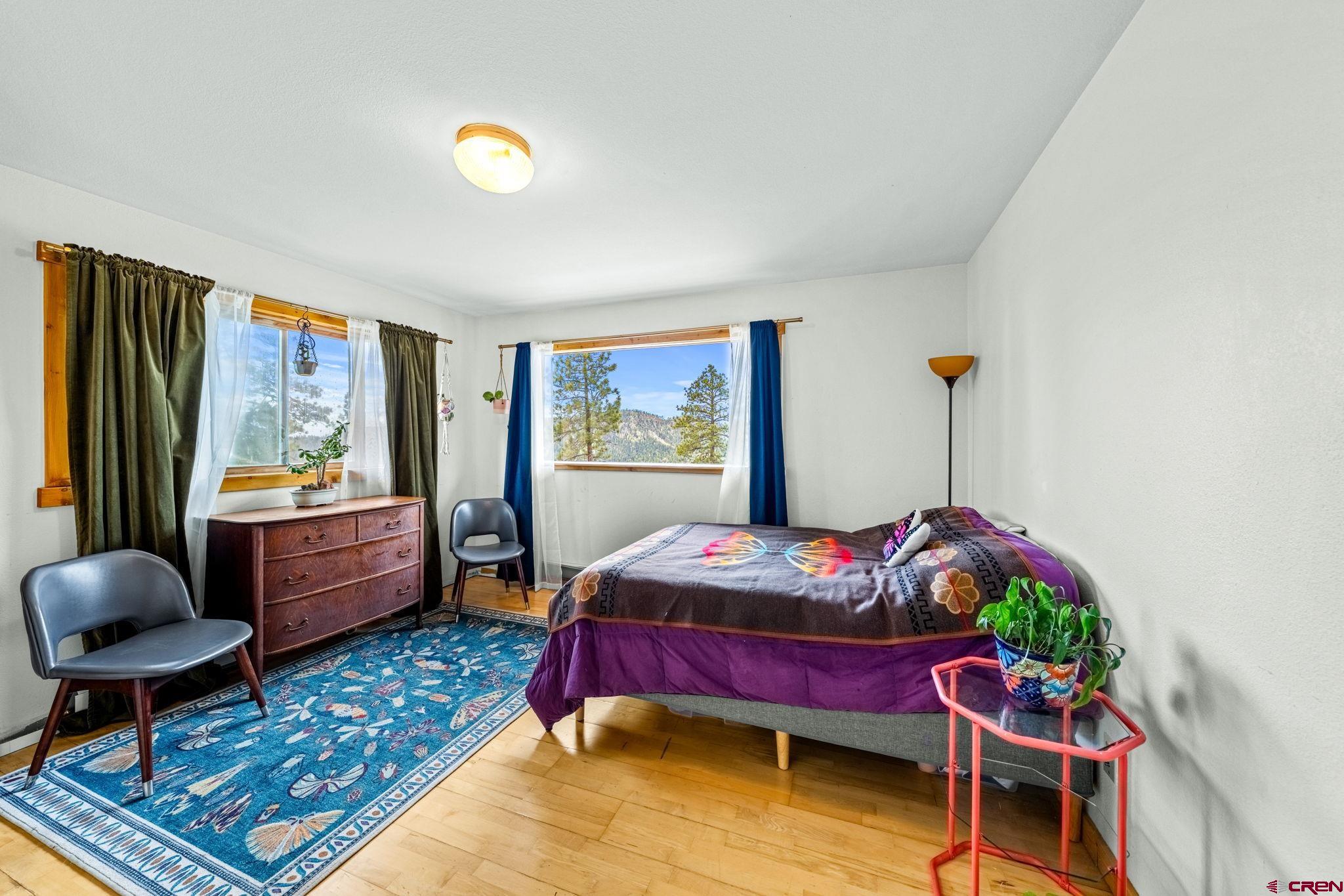 151 Sunny Lane Durango, CO 81301 - Photo 29 of 35 a bed room with furniture and a window