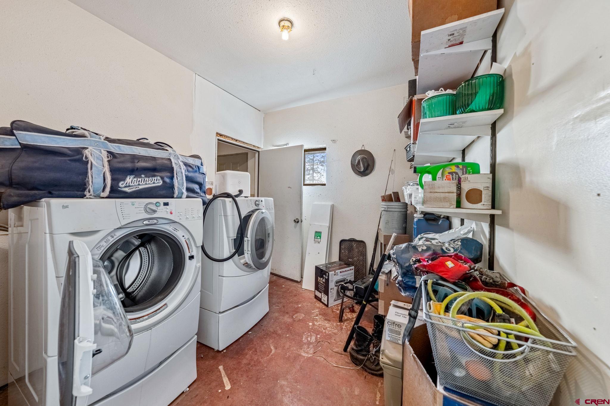 151 Sunny Lane Durango, CO 81301 - Photo 33 of 35 a utility room with dryer washer and other items