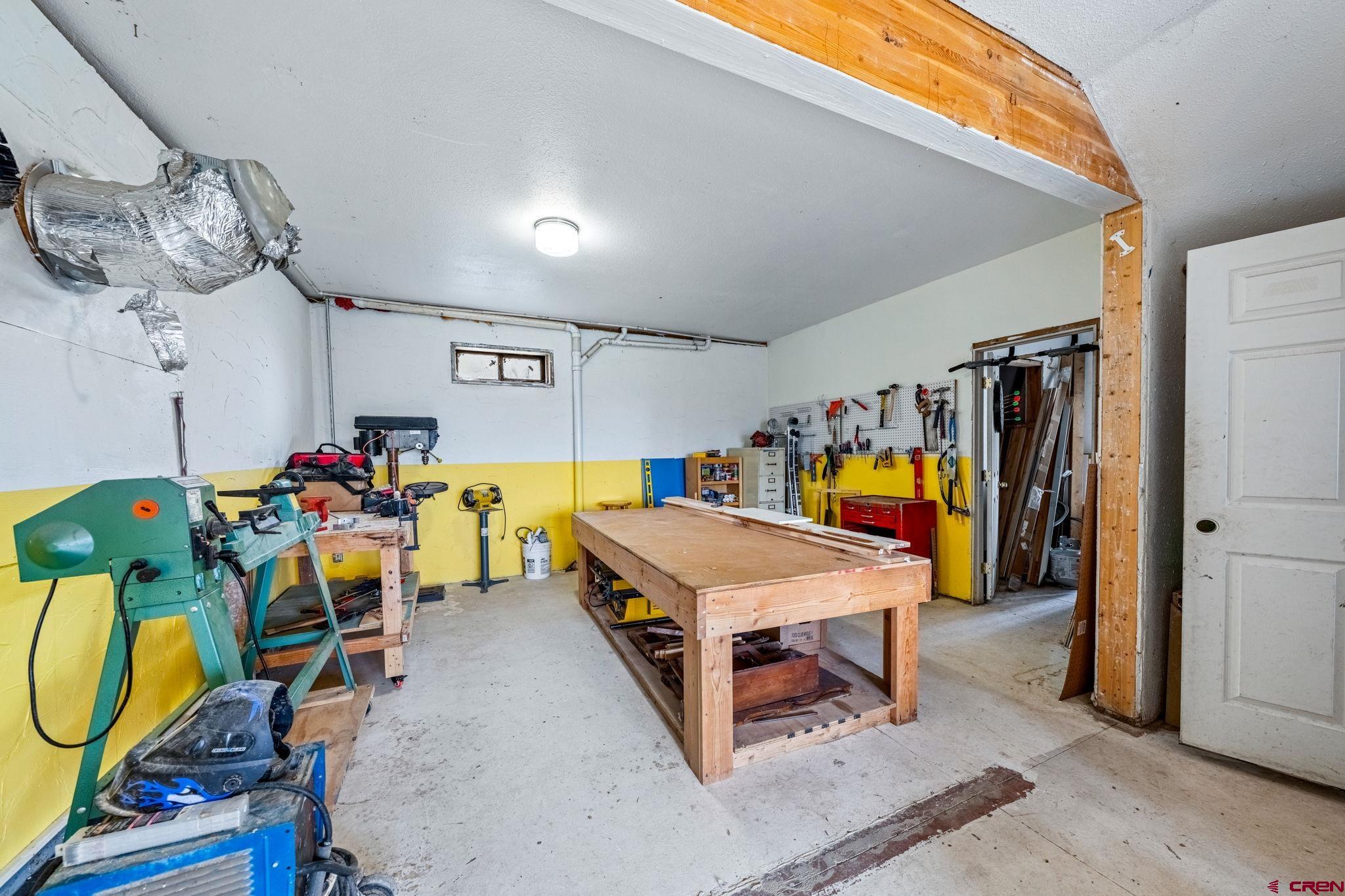 151 Sunny Lane Durango, CO 81301 - Photo 34 of 35 a living room with furniture and a flat screen tv