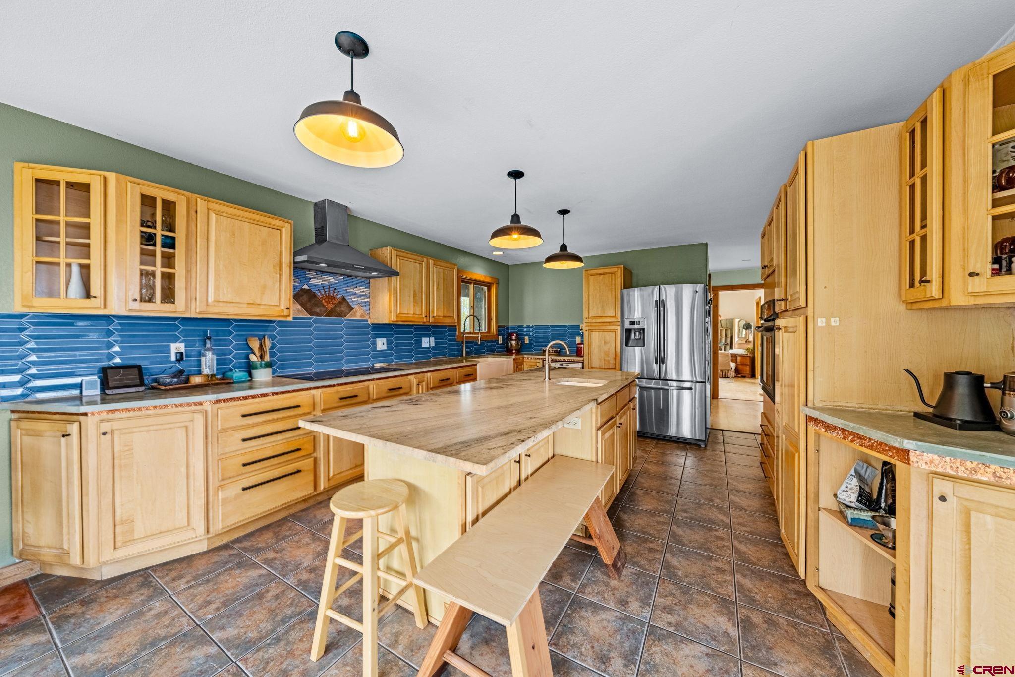 151 Sunny Lane Durango, CO 81301 - Photo 7 of 35 a kitchen with stainless steel appliances granite countertop a sink and cabinets