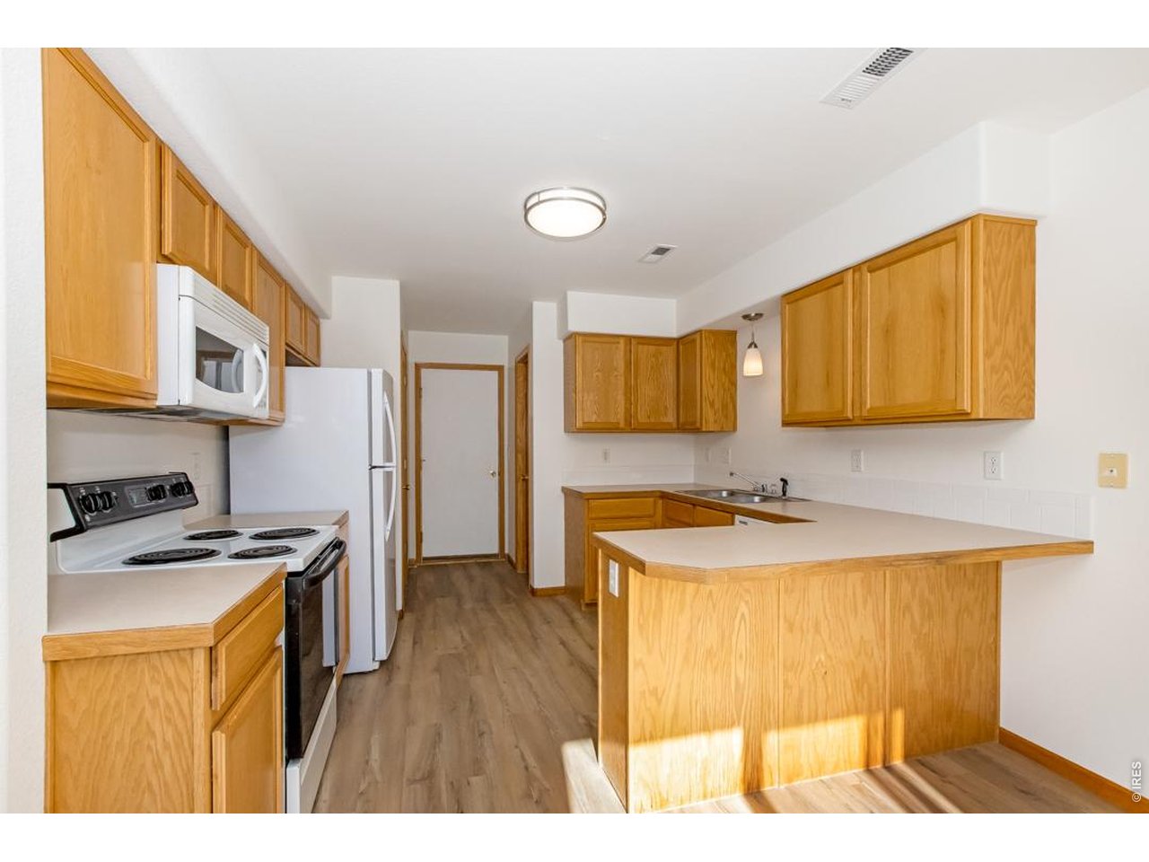 850 South Overland Trail, Unit 26 Fort Collins, CO 80521 - Photo 11 of 36 a kitchen with stainless steel appliances granite countertop a sink stove and refrigerator