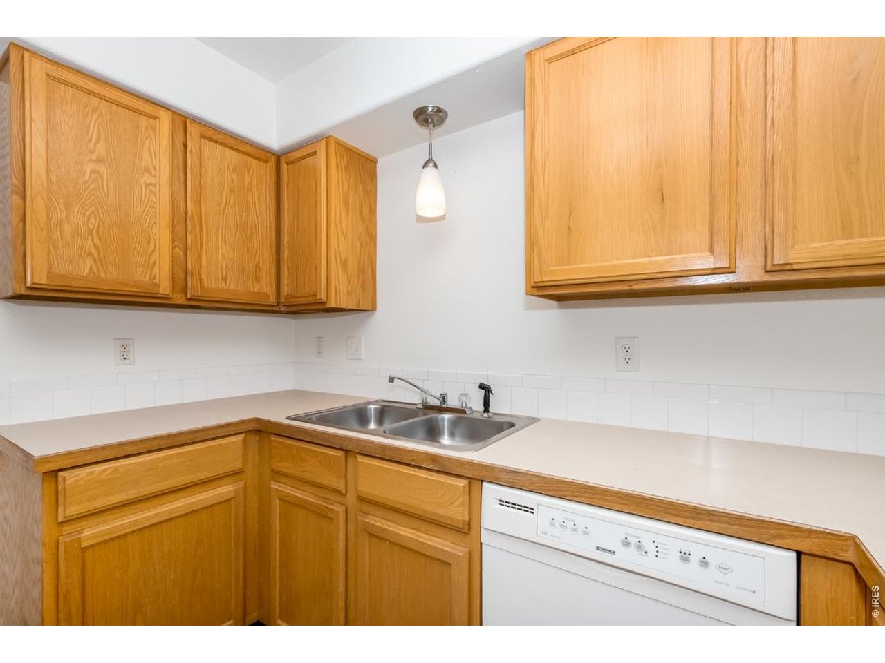 850 South Overland Trail, Unit 26 Fort Collins, CO 80521 - Photo 14 of 36 a kitchen with stainless steel appliances granite countertop white cabinets a sink and dishwasher