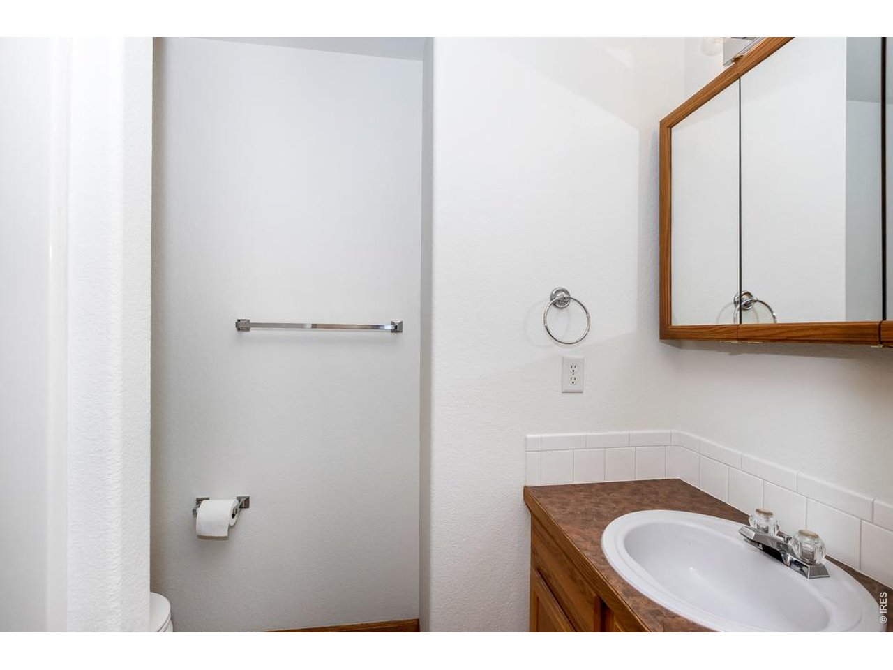 850 South Overland Trail, Unit 26 Fort Collins, CO 80521 - Photo 17 of 36 a bathroom with a sink and a mirror