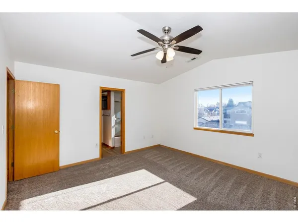 a view of a big room with wooden floor and closet