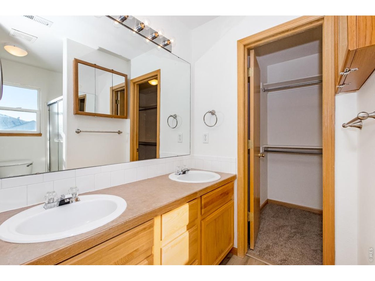 850 South Overland Trail, Unit 26 Fort Collins, CO 80521 - Photo 20 of 36 a bathroom with a sink and a mirror