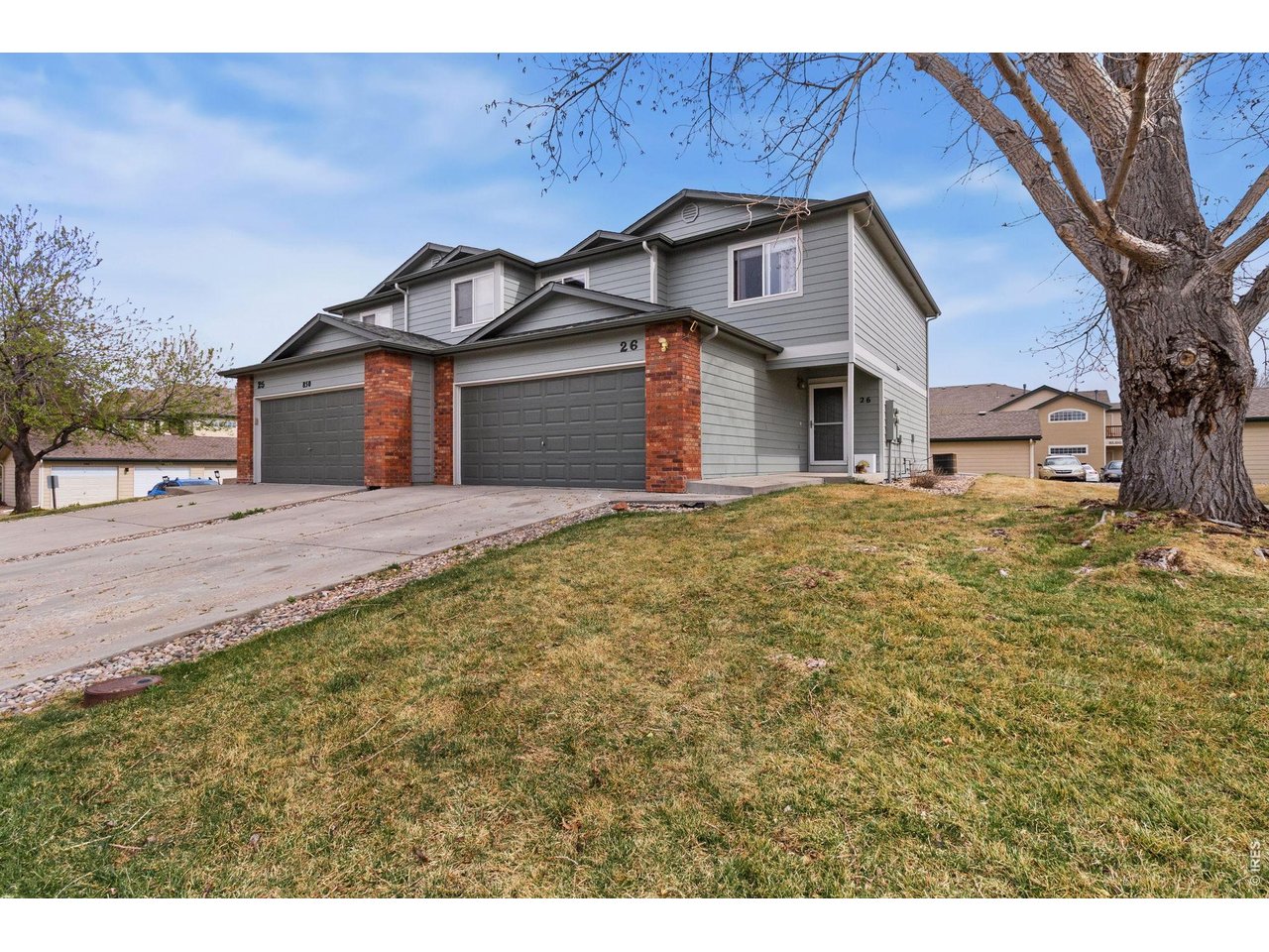 850 South Overland Trail, Unit 26 Fort Collins, CO 80521 - Photo 2 of 36 a front view of a house with a yard