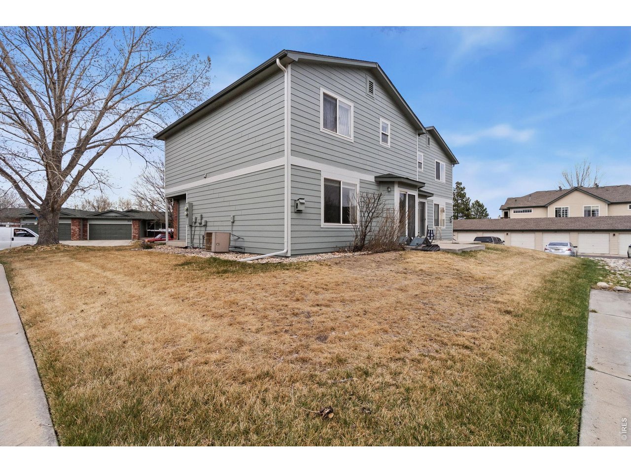850 South Overland Trail, Unit 26 Fort Collins, CO 80521 - Photo 30 of 36 a view of a yard with a large tree