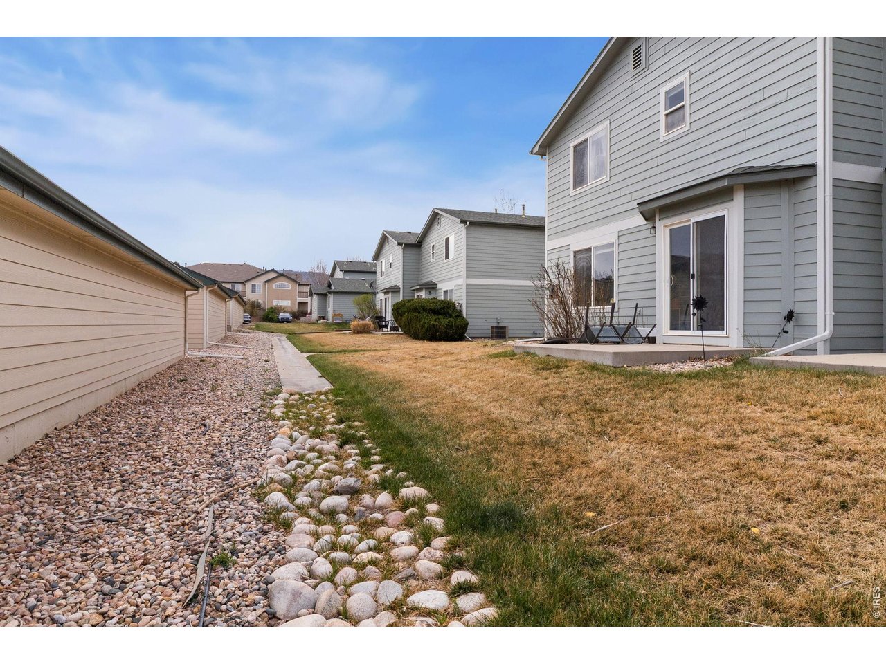 850 South Overland Trail, Unit 26 Fort Collins, CO 80521 - Photo 32 of 36 a view of a house with backyard outdoor seating area