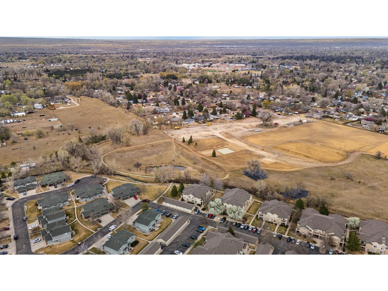850 South Overland Trail, Unit 26 Fort Collins, CO 80521 - Photo 33 of 36 an aerial view of residential building and parking space