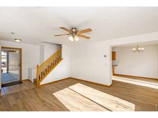 a view of an entryway with wooden floor