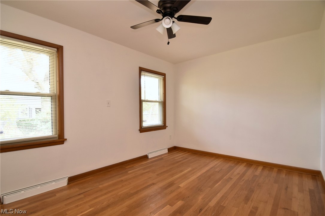 3681 Brinkmore Road Cleveland Heights, OH 44121 - Photo 18 of 27 Bedroom with ceiling fan, a healthy amount of sunlight, and light wood-type flooring