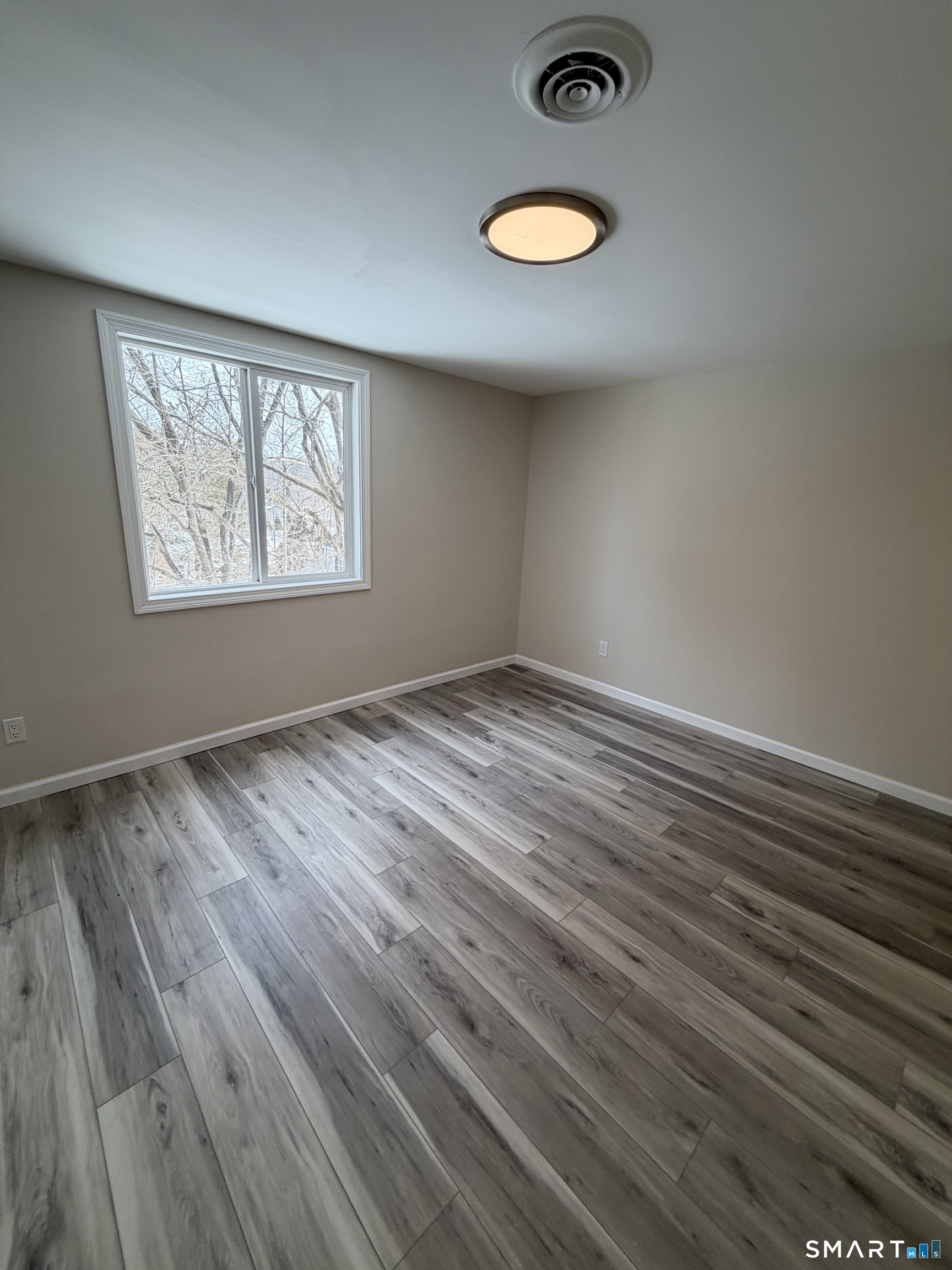 267 Branford Road, Unit 203 North Branford, CT 06471 - Photo 4 of 7 a view of empty room with wooden floor