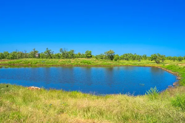 a view of a lake and a yard