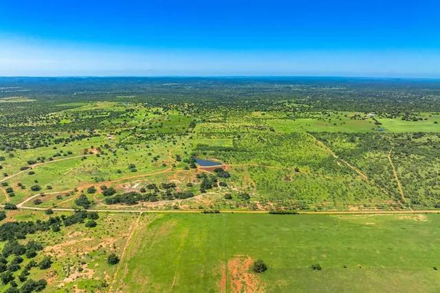 a view of a lake with a house in the background