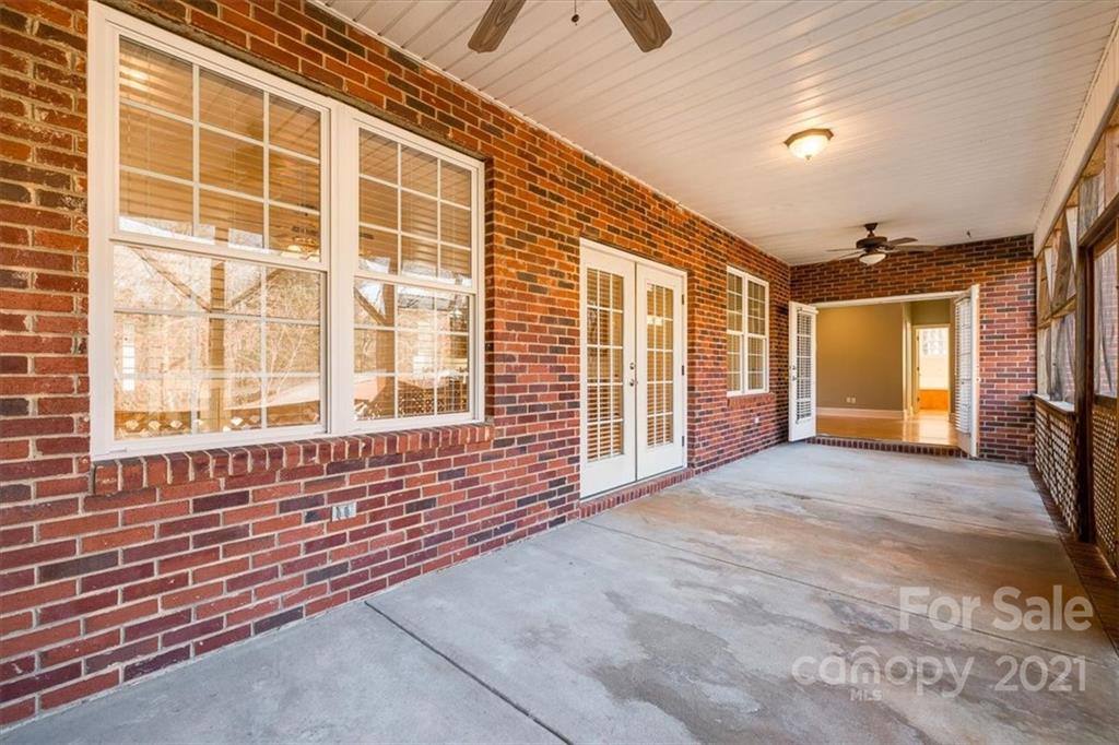 4503 Davis Road Edgemoor, SC 29712 - Photo 12 of 21 a view of an empty room with a fireplace and a large window