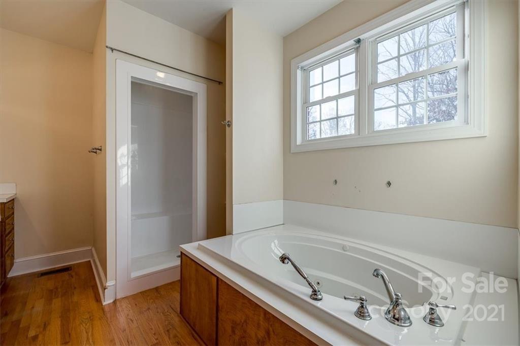 4503 Davis Road Edgemoor, SC 29712 - Photo 13 of 21 a bathroom with a tub sink and vanity