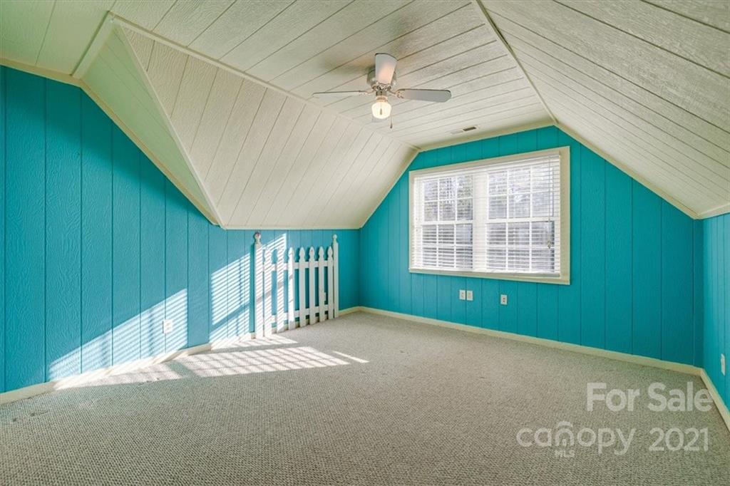 4503 Davis Road Edgemoor, SC 29712 - Photo 16 of 21 a view of an empty room with a window and wooden walls