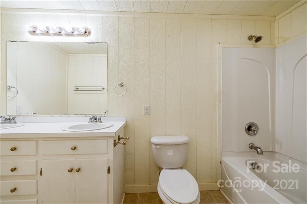 4503 Davis Road Edgemoor, SC 29712 - Photo 17 of 21 a bathroom with a sink toilet and shower