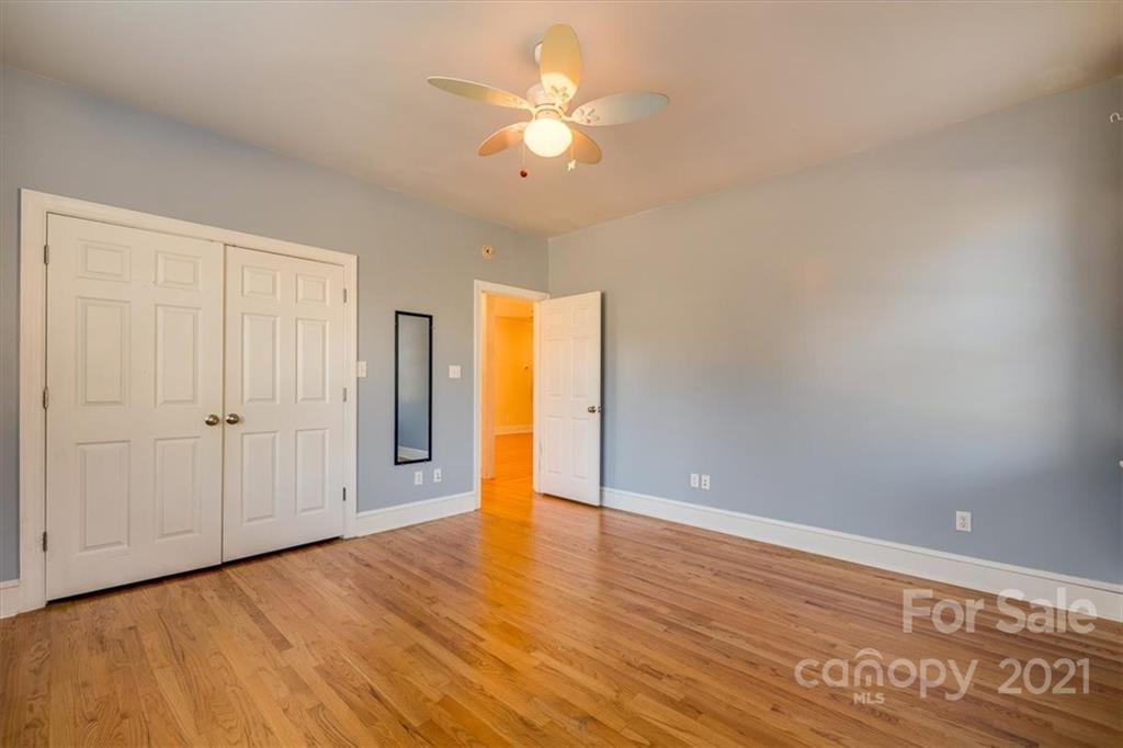 4503 Davis Road Edgemoor, SC 29712 - Photo 4 of 21 a view of an empty room with window and wooden floor