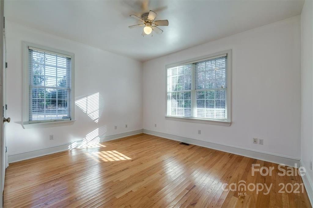 4503 Davis Road Edgemoor, SC 29712 - Photo 5 of 21 a view of empty room with wooden floor and fan