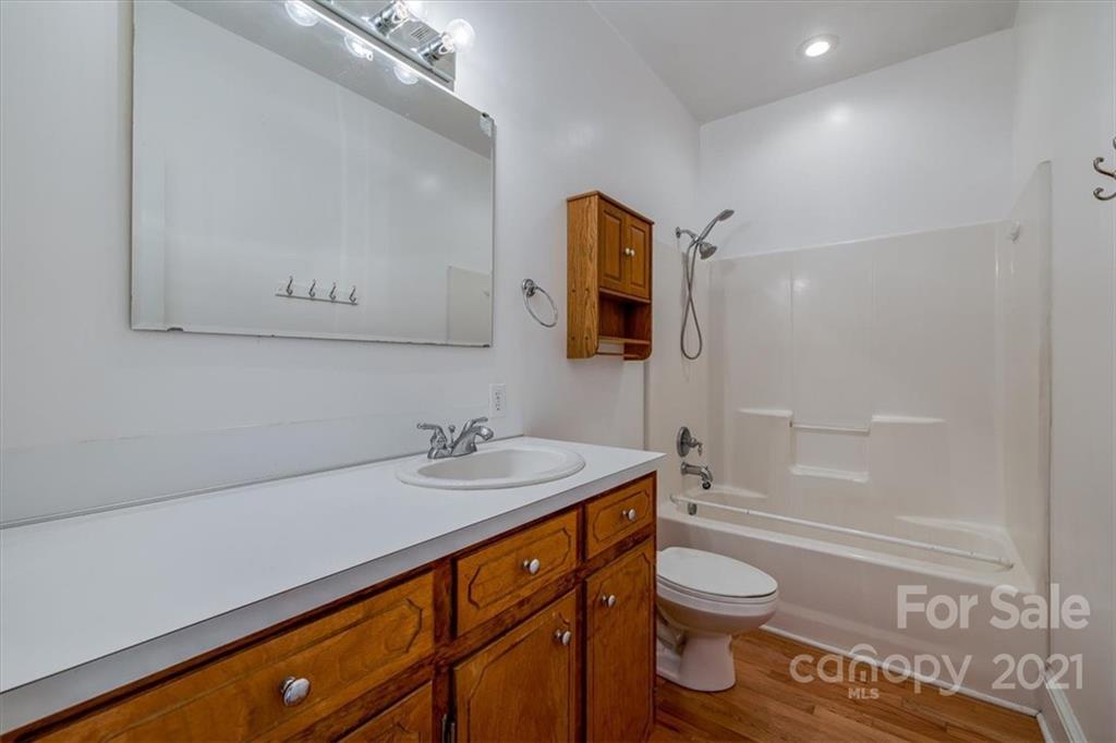 4503 Davis Road Edgemoor, SC 29712 - Photo 6 of 21 a bathroom with a granite countertop sink toilet and shower